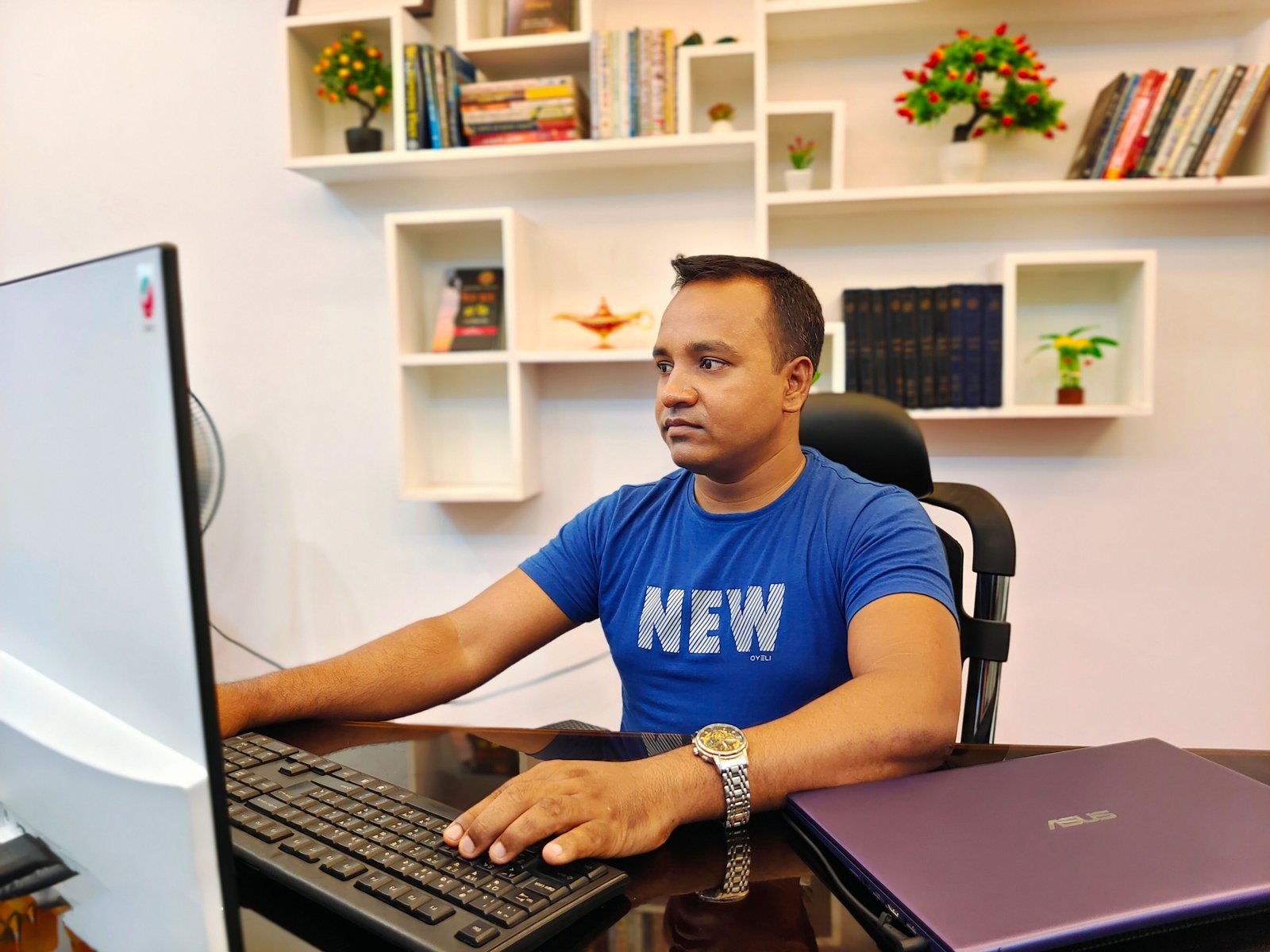 Khokon working on a WordPress site at his desk