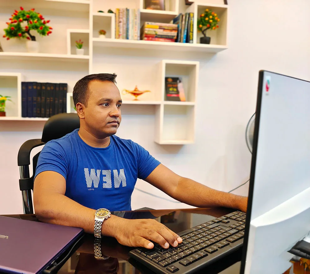 Khokon, WordPress security expert, working at his office desk
